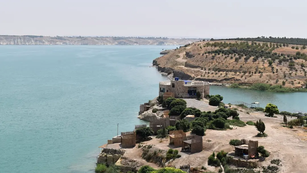 The point below the castle, where the shore runs out into the reservoir